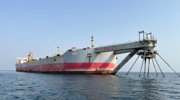 A giant ship tanker stands on water off the coast of Yemen