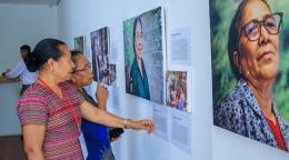 Timorese women veterans observe the canvases before them—portraits that held not just their faces, but the untold stories of their courage and sacrifices with their pictures and stories.