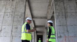 Two workers talking to each other