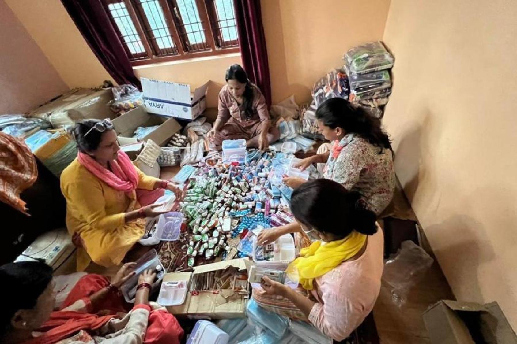 Women friendly disaster Management Group Forum for Women Law and Development assemble items for relief distribution for vulnerable groups in Kailali