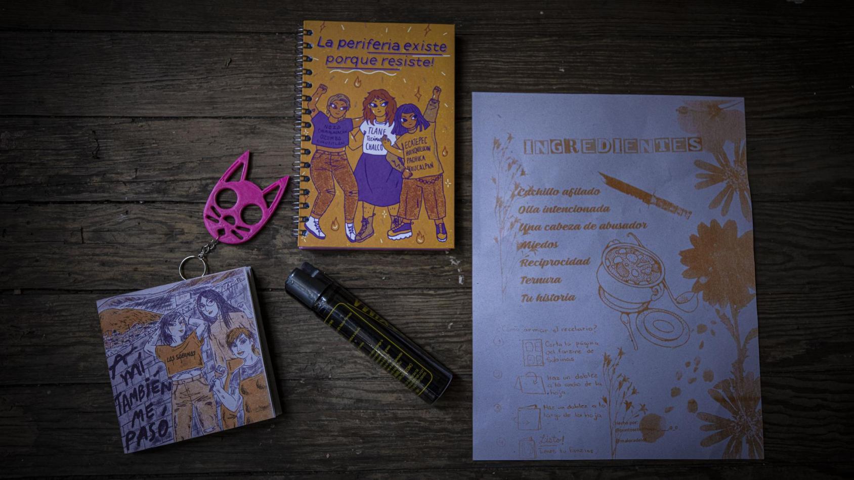 A group of books and stationery in colours of orange and pink with whimsical illustrations