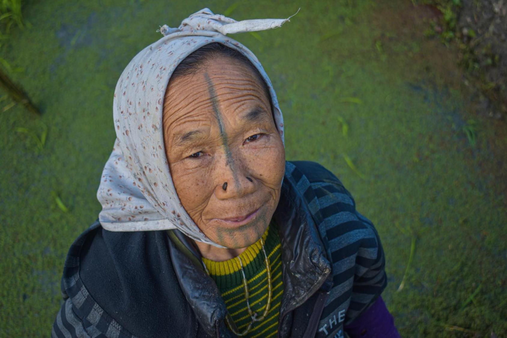 A woman with a head scarf.