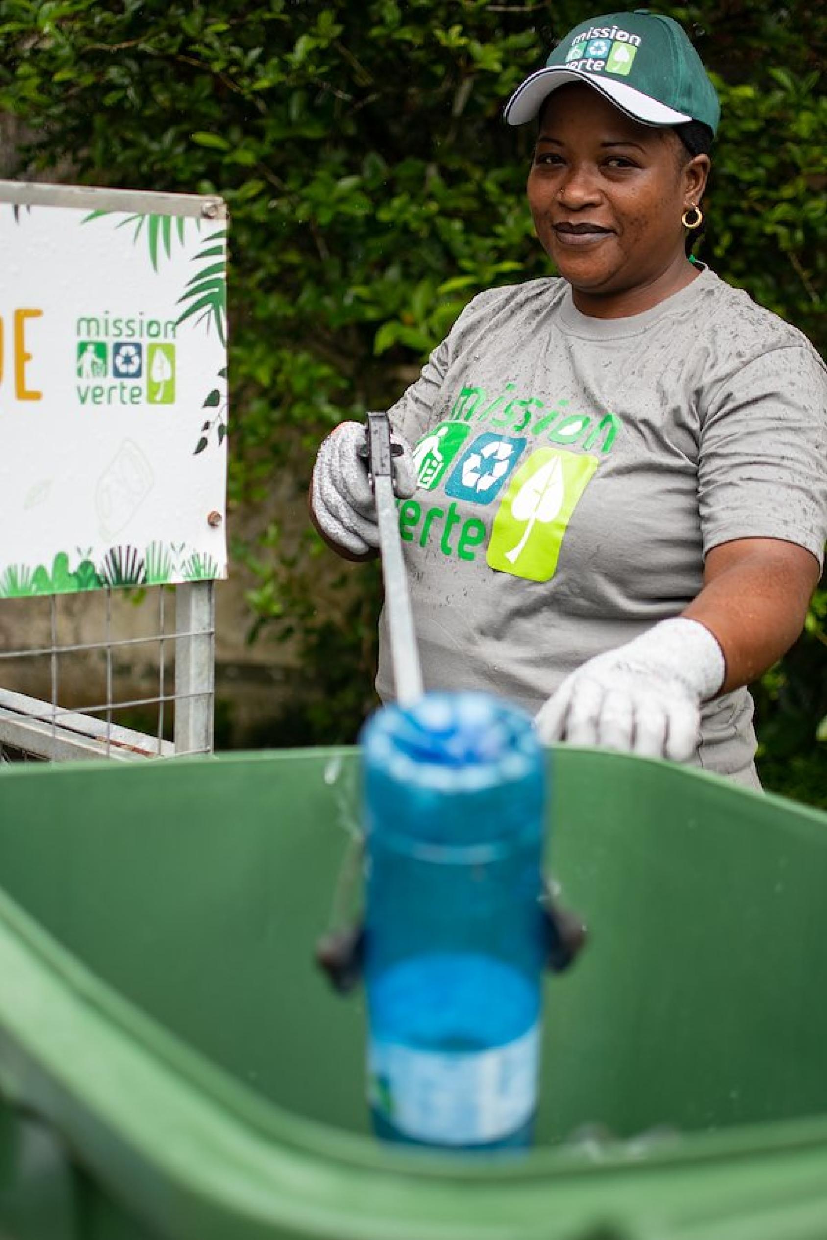 Christina Perrine throwing a plastic bottle in the bin