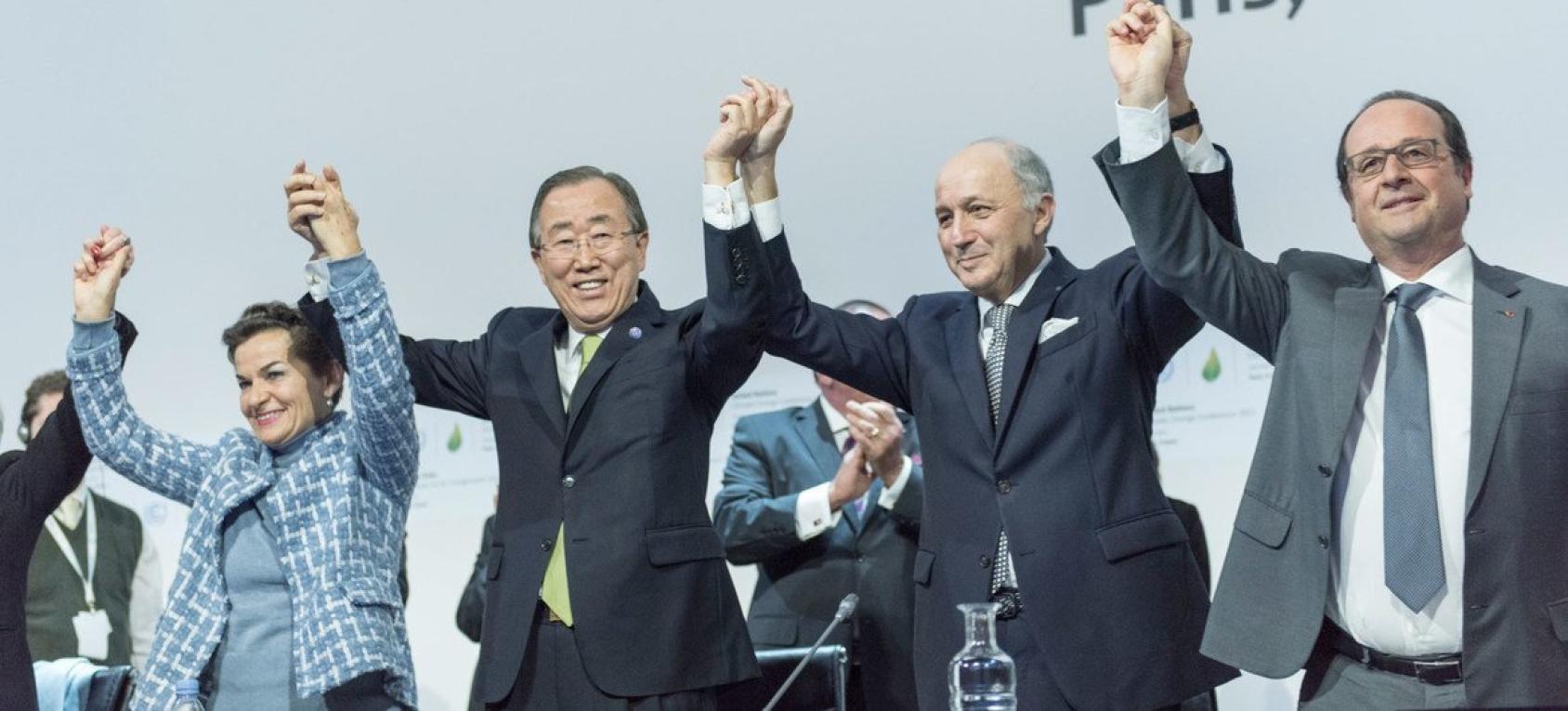 World leaders holding hands in triumph at the UN.
