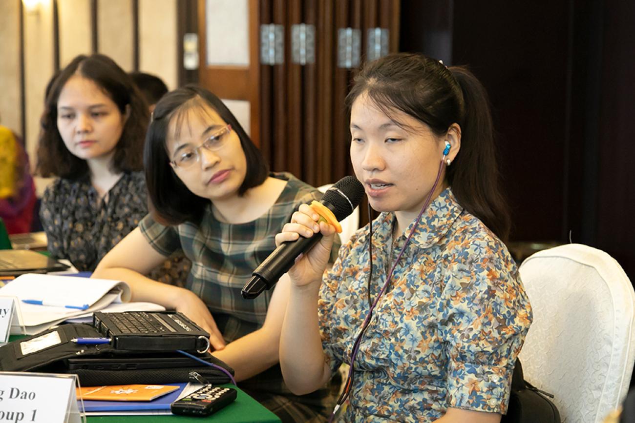 Banner shows Huong Dao Thu speaking into a microphone at a table with two women beside her.