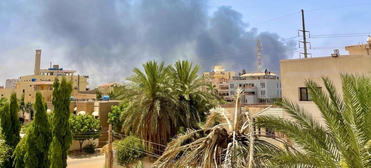 Picture of smoke fumes over buildings and trees in Khartoum