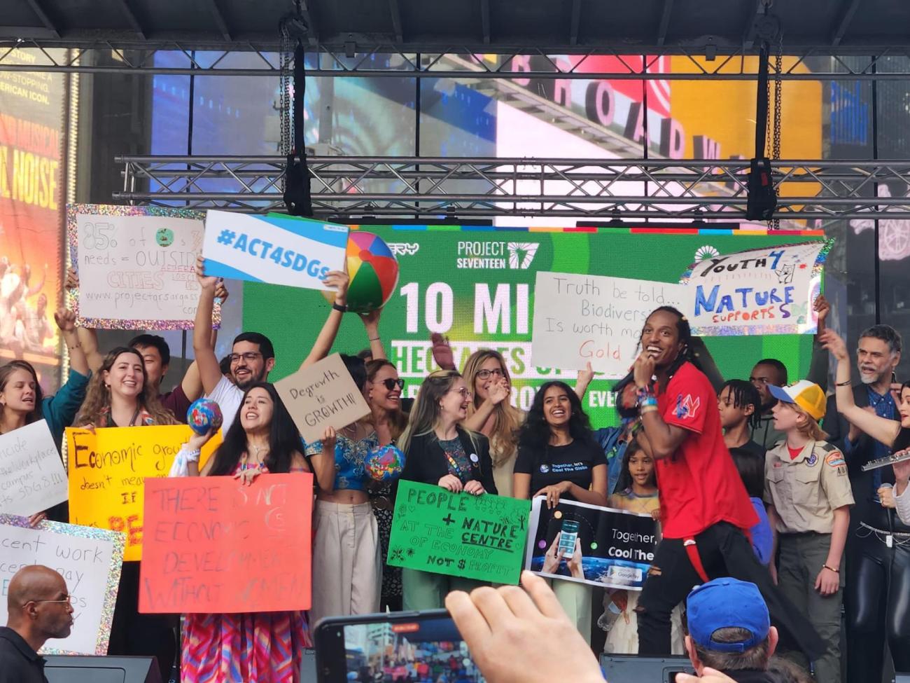 A group of people gathered on a stage in Central Park