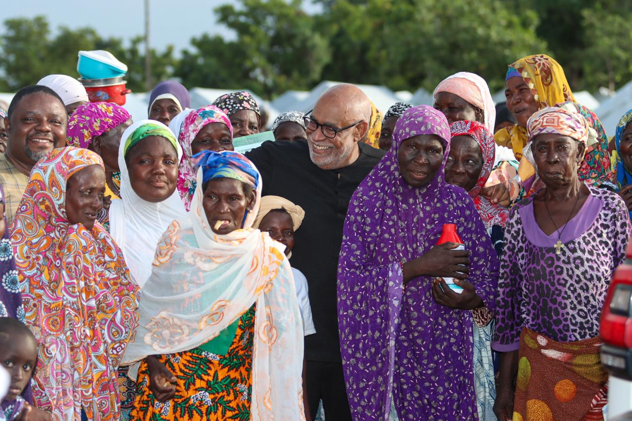 United Nations Resident Coordinator in Ghana Charles Abani, with a group of asylum seekers 