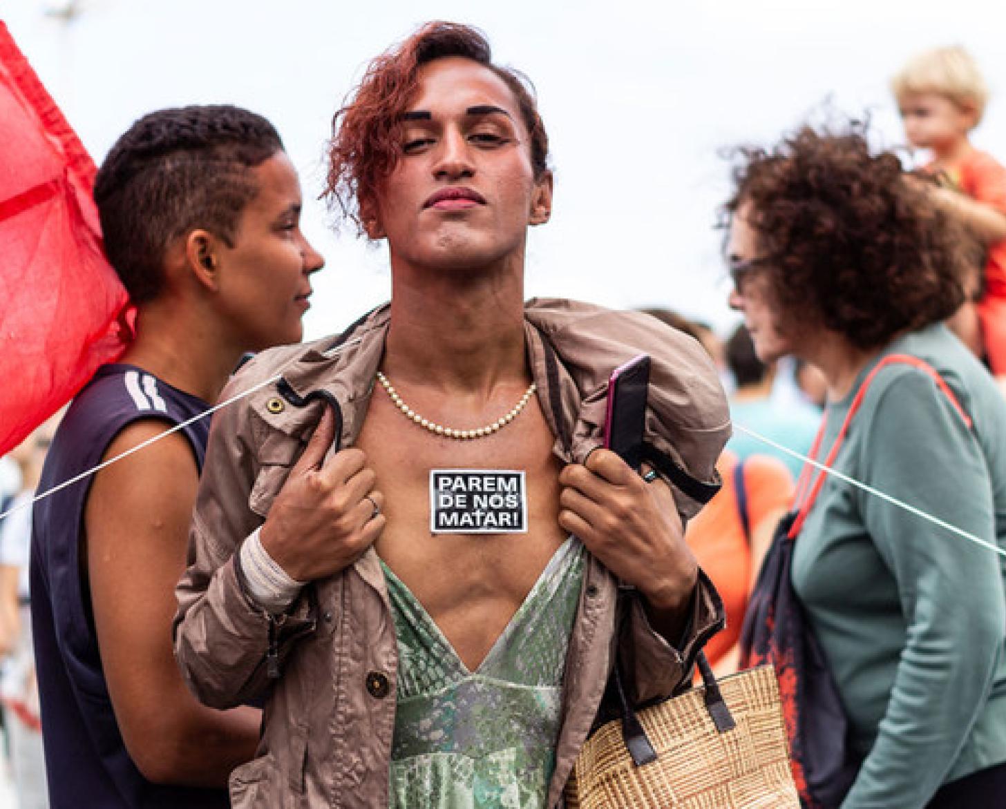 WellDonna Taiz Coelho advocates for her rights on the streets of Rio de Janeiro. The sticker on her chest reads "stop killing us."