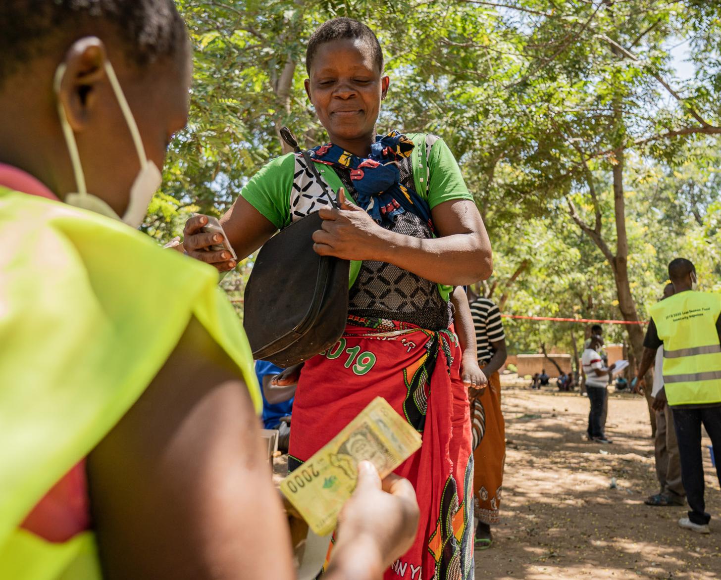 Woman waits for the cash transfer.