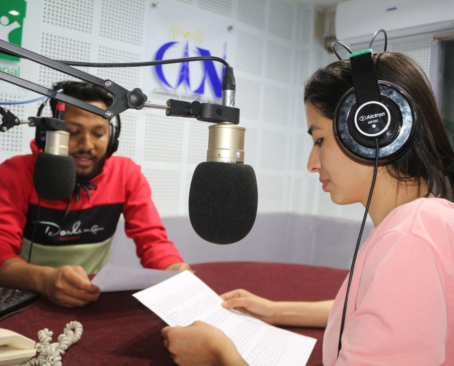 Two hosts of a radio program provide messages on COVID-19 symptoms and preventive measures, positive stories, mental wellbeing respect and care for returnees/migrants. 
