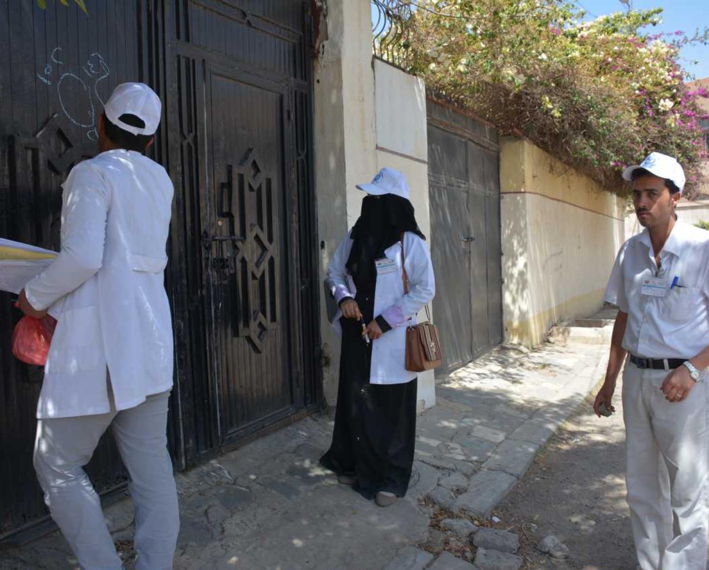 Healthcare workers are making house-to-house visits for COVID-19. 