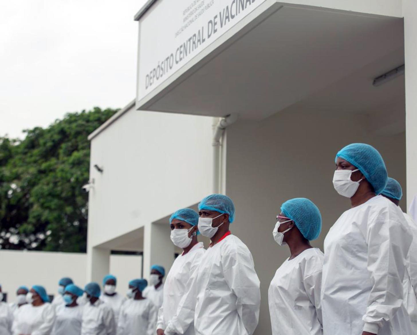 Health professionals line up outside the vaccination facility to administer Angola's first COVID-19 vaccines.