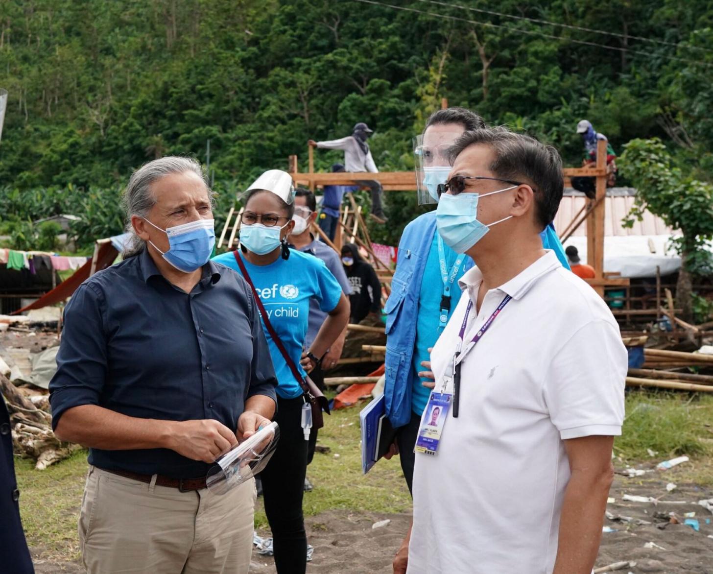 The UN Resident Coordinator in the Philippines, Gustavo González, visits a community affected by Typhoon Rai which struck the country in December 2021. 