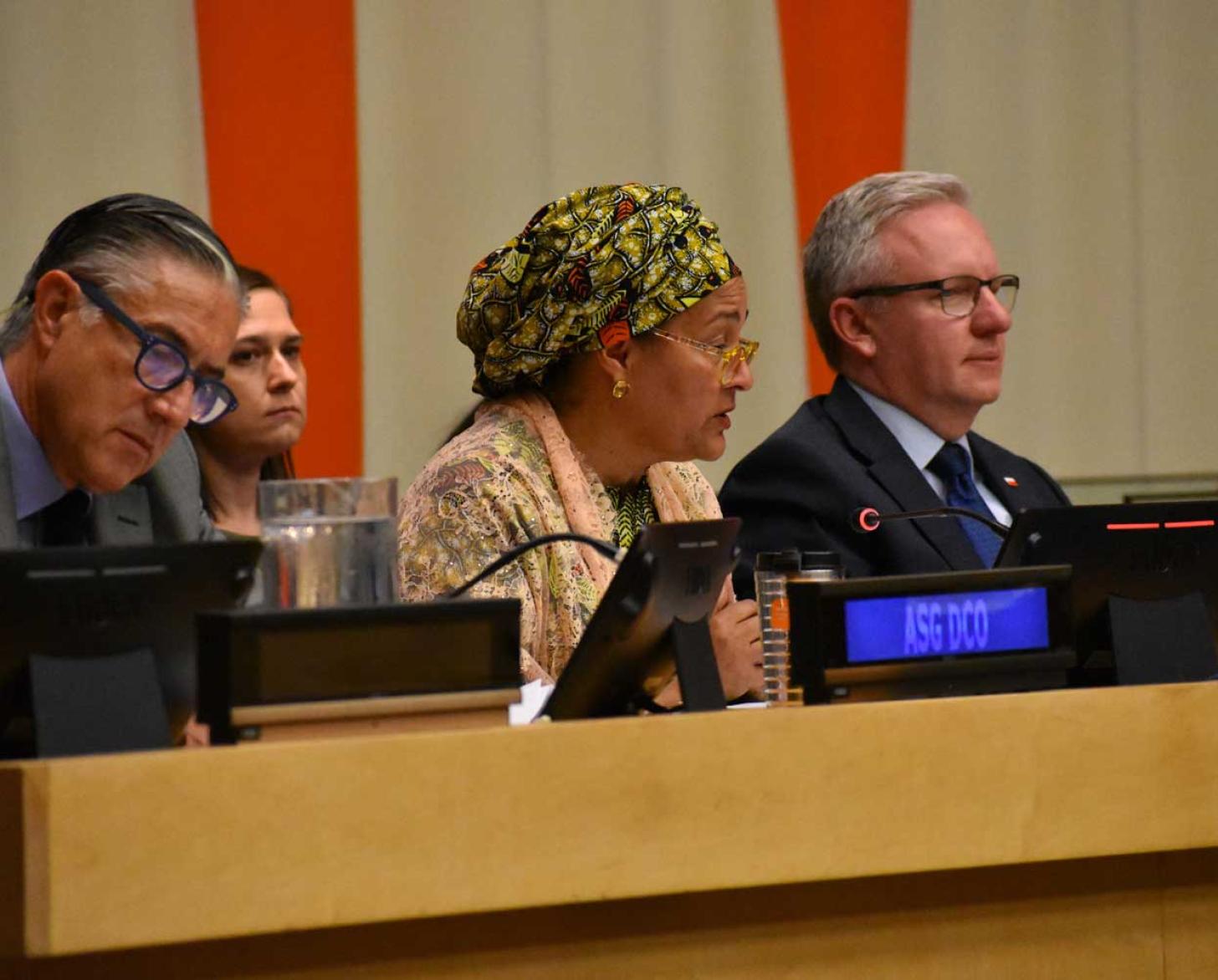 A speaker delivering remarks in a conference room.