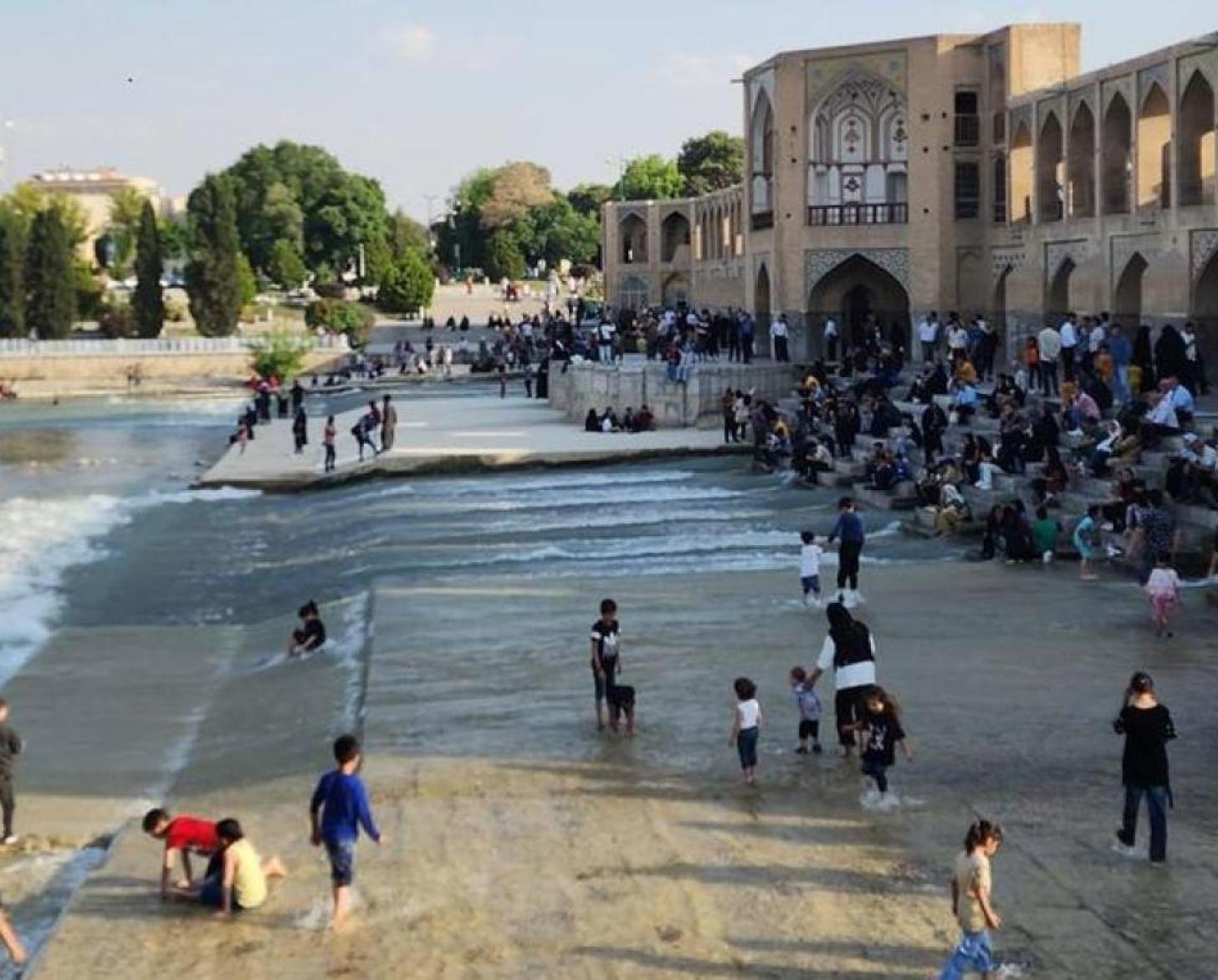 A group of children playing on the beach