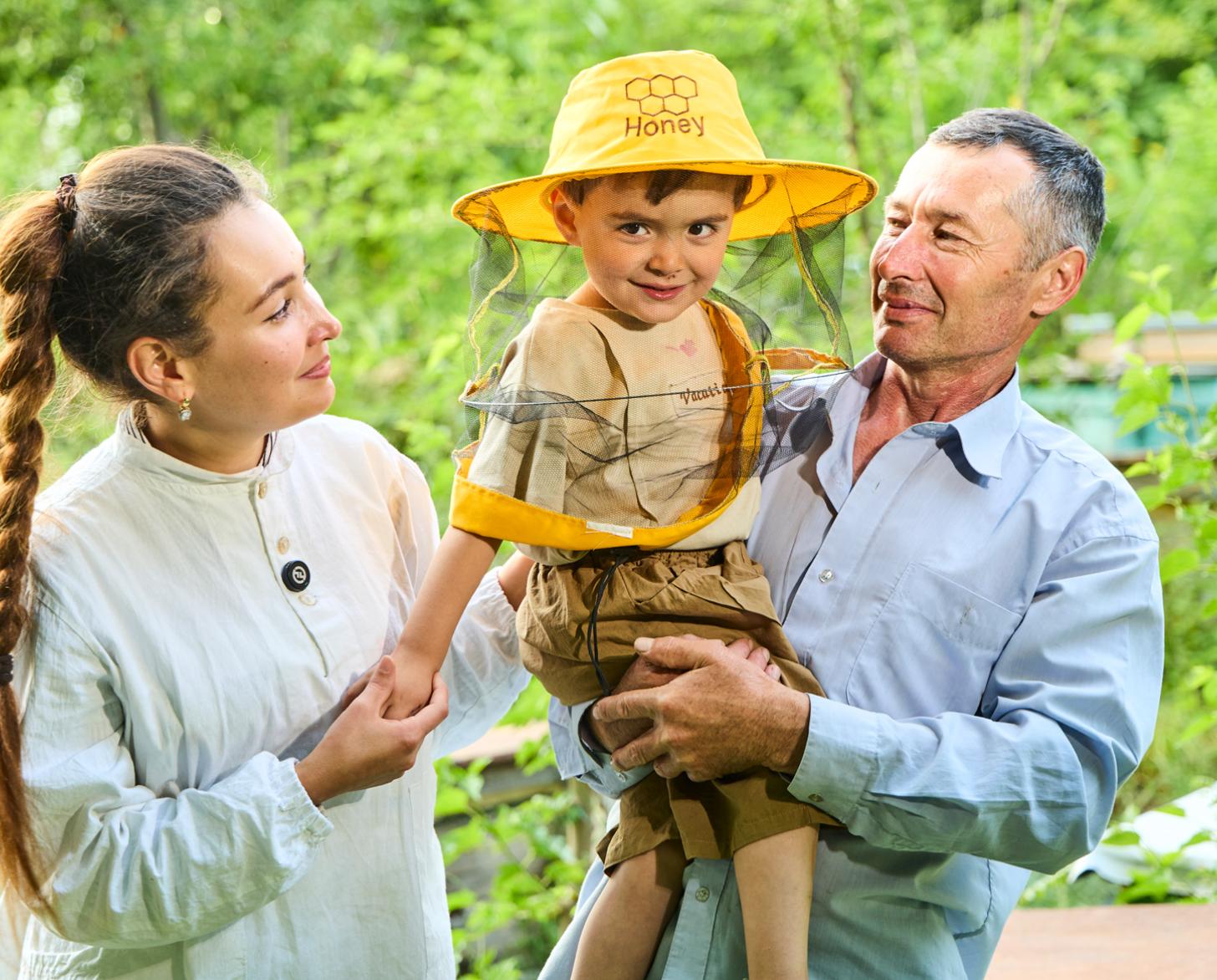 An Uzbek family consisting of a mother, father and young son.