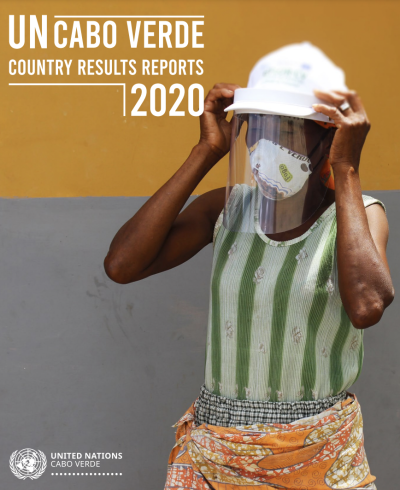 A woman face mask adjusts her face shield with two hands.