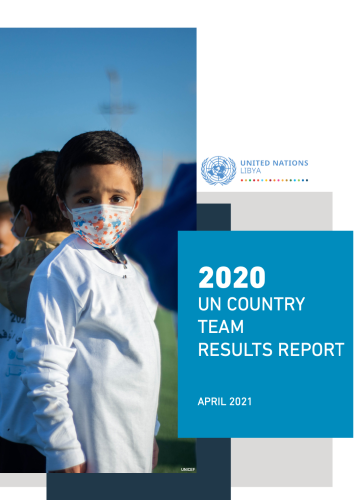 A child in a face mask and white shirt faces the camera