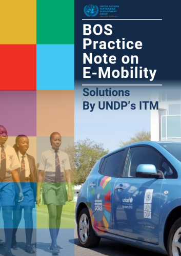 An electric vehicle with three girl students walking next to it (Namibia).